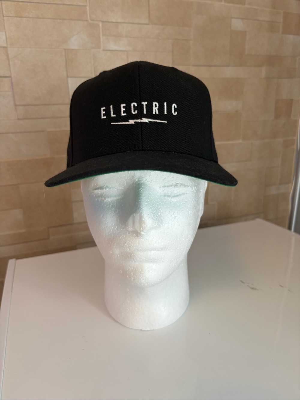 Electric Black Snapback Hat with White Logo